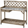 Table de jardinage 120 x 50 x 120 cm en bois gris avec plateau métallique treillis et rangement